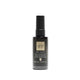 GHD Silk Operator wet and dry smoothing oil in a 1.5 fl. oz. black spray bottle, shown on a solid white background.