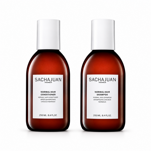 Two bottles of Sachajuan shampoo and conditioner on a white background