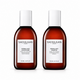 Two bottles of Sachajuan shampoo and conditioner on a white background
