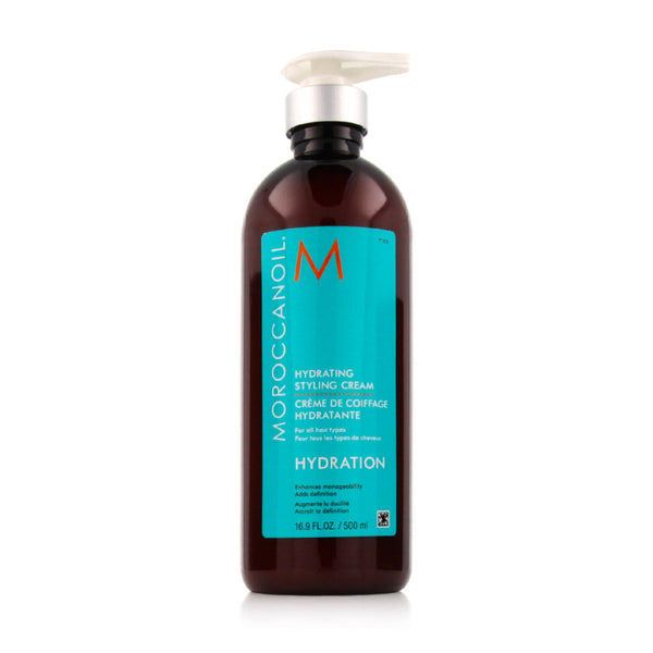 Moroccanoil Hydrating Styling Cream in a dark amber bottle with a turquoise label and a white pump dispenser, shown on a clean white background.