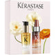 Kérastase hair care product set with flowers on a light pink background