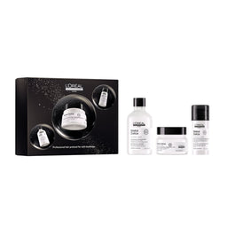 L'Oréal Professionnel Anti-Grève hair treatment set featuring a black gift box and three white bottles and jars with black caps: Scalp Care, Dandruff Care, and Hair Care.