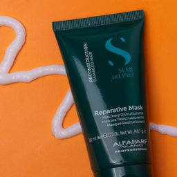 Alfaparf Semi Di Lino Reparative Mask tube on an orange background