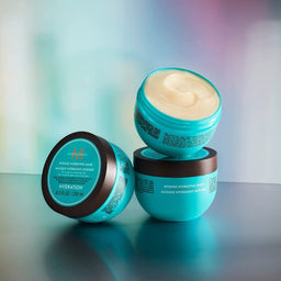 three tubs of Moroccanoil Intense Hydrating Mask