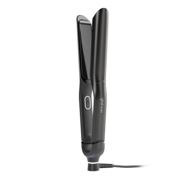 A black flat iron hair straightener with a power button and a small white logo on the handle, shown on a plain white background with its cord visible.