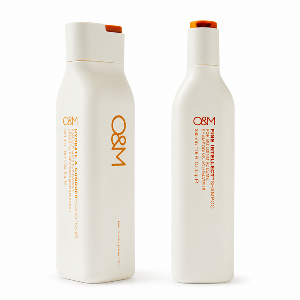 Two white bottles with orange text on a white background