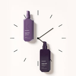 Two purple bottles with black caps on a white background