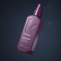 Purple bottle of Kevin Murphy hair product on a dark background