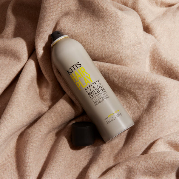 KMS Hair Play product on a beige fabric background