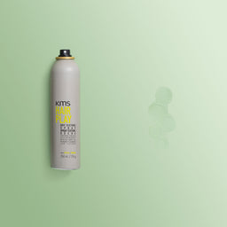 KMS Hair Play spray can on a light green background