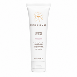 A white tube of Innersense I Create Volume volumizing lotion with gold and dark red text and logo, centered on a plain white background.