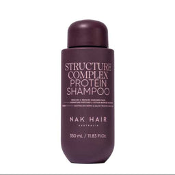 A bottle of NAK HAIR Structure Complex Protein Shampoo in a deep plum purple color, shown against a plain white background.