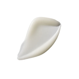 A single smooth, teardrop-shaped cream-colored silicone or rubber pad on a solid white background.