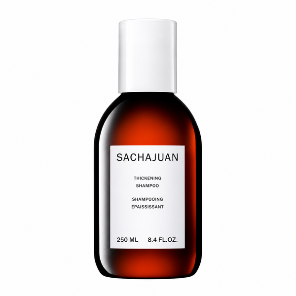 Sachajuan Thickening Shampoo in a 250 ml (8.4 fl. oz.) amber glass bottle with a white cap and a white label.