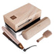 ghs clonos hair straightener set in champagne beige, featuring a flat iron, a zippered carrying case, and a wide-tooth comb brush, displayed with its retail packaging box on a white background.