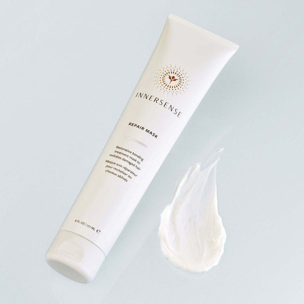 Innersense repair mask tube with a sample on a light gray background